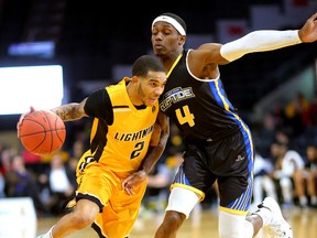 Xavier Moon of the Lightning drives against Brent Arrington of the Saint John Riptide during their game on Sunday, January 13, 2019 at Budweiser Gardens in London, Ont. The Lightning fell 107-98 against the Riptide who were 4-12 entering the game. (Mike Hensen/The London Free Press)