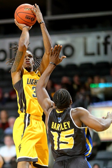 Another jumper by Anthony "AJ" Gaines of the Lightning over Frank Bartley of the Saint John Riptide during their Sunday afternoon game at Budweiser Gardens in London, Ont. The Lightning fell 107-98 against the Riptide who were 4-12 entering the game.
Photograph taken on Sunday January 13, 2019. 
Mike Hensen/The London Free Press/Postmedia Network