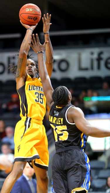 Another jumper by Anthony "AJ" Gaines of the Lightning over Frank Bartley of the Saint John Riptide during their Sunday afternoon game at Budweiser Gardens in London, Ont. The Lightning fell 107-98 against the Riptide who were 4-12 entering the game.
Photograph taken on Sunday January 13, 2019. 
Mike Hensen/The London Free Press/Postmedia Network