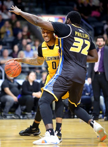 Maurice Bolden of the Lightning tries to drive in against Randy Phillips of the Saint John Riptide during their Sunday afternoon game at Budweiser Gardens in London, Ont. The Lightning fell 107-98 against the Riptide who were 4-12 entering the game.
Photograph taken on Sunday January 13, 2019. 
Mike Hensen/The London Free Press/Postmedia Network