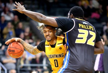 Maurice Bolden of the Lightning tries to drive in against Randy Phillips of the Saint John Riptide during their Sunday afternoon game at Budweiser Gardens in London, Ont. The Lightning fell 107-98 against the Riptide who were 4-12 entering the game.
Photograph taken on Sunday January 13, 2019. 
Mike Hensen/The London Free Press/Postmedia Network
