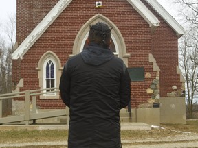 A victim of disgraced ex-cleric David Norton stands outside of St. Andrew's Anglican church at Chippewa of the Thames First Nation, where Norton served in 1977. Norton was found guilty of charges of molesting four altar boys in the community southwest of London, Ont.  Photograph taken on Thursday January 17, 2019.  He is referred to in this story as "the whisteblower." Mike Hensen/The London Free Press/Postmedia Network