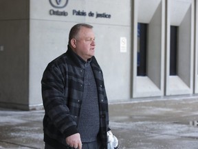 Father Amer Saka leaves court. Derek Ruttan/The London Free Press