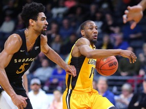 Marcus Capers of Lightning drives sideline around Cory Dixon of the Sudbury 5 on his way to the hoop in the first quarter of their game against the Sudbury 5 at Budweiser Gardens. Photograph taken on Sunday January 27, 2019.  (Mike Hensen/The London Free Press)