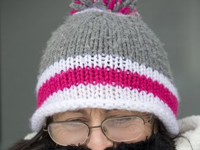 Angela MacDonald is bundled up during a cold day in London, Ont. on Monday January 28, 2019. Derek Ruttan/The London Free Press/Postmedia Network