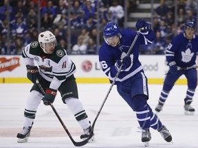 Maple Leafs forward Mitch Marner (right) wheels past Zach Parise of the Minnesota Wild on Thursday at Scotiabank Arena. Marner had two goals in Toronto's 4-3 loss. (Jack Boland/Toronto Sun)