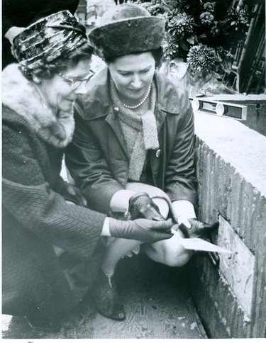 Mrs. T.L. Gillespie, matron, left and Mrs. A.B. conron, president board of trustees, place the cornerstone for the new Protestant Orphans' Home on Richmond Street, 1967. (London Free Press files)