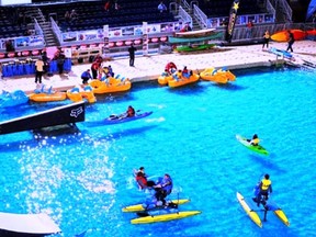 Visitors to the Toronto International Boat Show boat show have fun on a lake built just for the show.