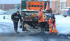 City workers clean up a section of Culver Drive Friday after a car collided with a bus and caught fire. Nobody was injured, police said. DALE CARRUTHERS / THE LONDON FREE PRESS