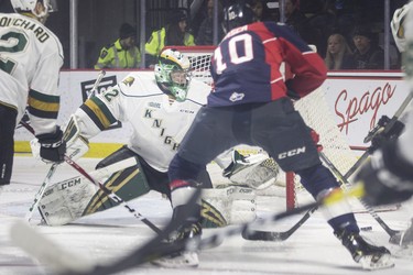 Windsor's Jordan Frasca tries to get his stick on the puck in front of London goalie, Joseph Raaymakers, during first period of OHL action between the Knights and the Spitfires at the WFCU Centre, Thursday, Jan. 24, 2019.  (DAX MELMER/Postmedia News)