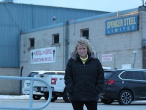 Donna Szpakowski, the general manager of the Hyde Park Business Improvement Association, stands in front of a building that houses a medical marijuana growing operation on North Routledge Park in London. Neighbouring businesses have complained to the association about the smell coming from the building. DALE CARRUTHERS / THE LONDON FREE PRESS