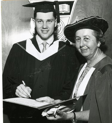 John M. Kopas, registrar of Waterloo University College, signs the honorary degree certificate of Miss Helen M.B. Allison, the registrar of the University of Western Ontario at spring convocation. Back in 1956 Miss Allison signed Mr. Kopas' degree when he graduated from UWO, 1962. (London Free Press files)