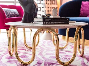 A sinuous gold-legged coffee table contributes sensuality and curves to a space.