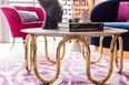 A sinuous gold-legged coffee table contributes sensuality and curves to a space.
