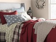 Layering up your bed this winter is an easy way to achieve coziness indoors. Photo: HomeSense for The Home Front: Getting cozy this winter by Rebecca Keillor [PNG Merlin Archive]