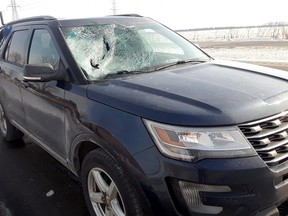 A car windshield was damaged by ice that flew off the roof of a tractor trailer while both vehicles were travelling west on Highway 401 in Chatham-Kent on Saturday. (Handout/Chatham Daily News)