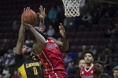 Windsor's Juan Patillo drives to the basket while London's Maurice Bolden defends during NBLC action between the Windsor Express and the London Lightning at the WFCU Centre, Wednesday, February 6, 2019.  (DAX MELMER/Windsor Star)