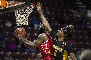 Windsor's Juan Patillo drives to the basket while London's Maurice Bolden defends during NBLC action between the Windsor Express and the London Lightning at the WFCU Centre, Wednesday, February 6, 2019.  (DAX MELMER/Windsor Star)