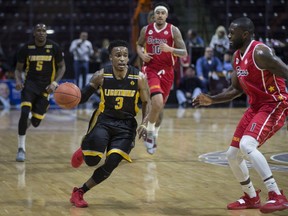 London's Alex Johnson sprints down the court while being defended by Windsor's Juan Pattillo in NBLC action between the Windsor Express and the London Lightning at the WFCU Centre, Wednesday, February 6, 2019.  (DAX MELMER/Windsor Star)