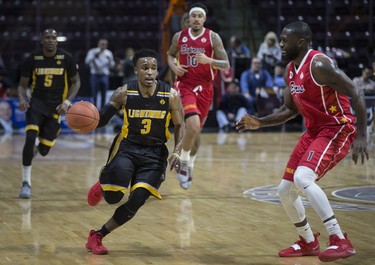 London's Alex Johnson sprints down the court while being defended by Windsor's Juan Pattillo in NBLC action between the Windsor Express and the London Lightning at the WFCU Centre, Wednesday, February 6, 2019.  (DAX MELMER/Windsor Star)