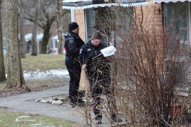 Police canvassed the area around Arbour Glen Crescent and Kipps Lane after a man was shot with an arrow and later died in the hospital on Tuesday. (DALE CARRUTHERS, The London Free Press)