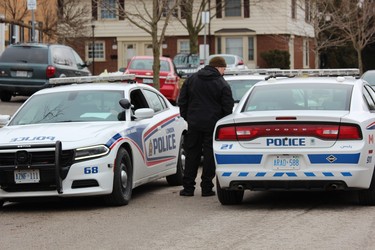 There was a heavy police presence outside of 67 Abour Glen Cres. on Tuesday. Police were called to the address at 12:50 a.m. for a report of a man shot with an arrow. The man later died in the hospital. (DALE CARRUTHERS, The London Free Press)