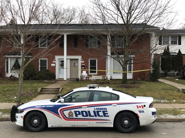 A London police cruiser is seen outside a home on Arbour Glen Crescent by Kipps Lane. Police are investigating after a man was hit with an arrow and was taken to hospital with life-threatening injuries. (JONATHAN JUHA, The London Free Press)