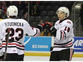 Niagara Ice Dogs Jason Robertson, right, bumps gloves with Jack Studnicka after the pair combined for the IceDogs second goal against the Kingston Frontenacs during Ontario Hockey League action at the Leon's Centre in Kingston on Friday February 1, 2019. (Ian MacAlpine/Postmedia Network)