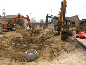 Sanitary and storm sewer separation tear a big gap in York Street west of Ridout in May 2018. Phase 2 of the city's plan to replace the aging sewer under York Street will begin in April and cost more than $7 million to do the section between Talbot to Clarence streets.  (Mike Hensen/The London Free Press)