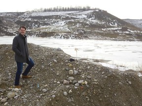 Jonathan Aarts stands inside the Byron gravel pit, near the small lake at its base in west London, where he hopes to build a mixed-use community. Mike Hensen/The London Free Press/Postmedia Network