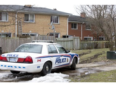 Police on scene at the rear of 67 Arbour Glen Crescent where a man died after being wounded by an arrow in London, Ont. on Tuesday February 5, 2019. (Derek Ruttan/The London Free Press)