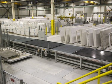 Bags of crushed quartz (left) are formed into finished slabs (right) at the London manufacturing plant.  (Derek Ruttan, The London Free Press)