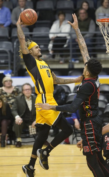 Mo Bolden of  the London Lightning charges the net defended by Ty Walker of the Windsor Express in London, Ont. on Thursday February 7, 2019. Derek Ruttan/The London Free Press/Postmedia Network