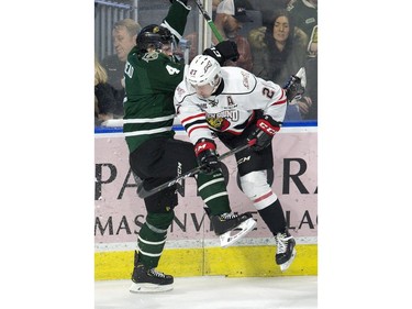 London Knight defenceman William Lochead collides in the corner with Aidan Dudas of the Owen Sound Attack  in London, Ont. on Friday February 8, 2019. (Derek Ruttan/The London Free Press)