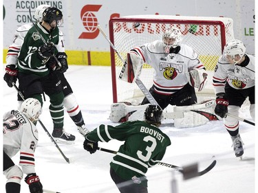 Adam Boquist  of the London Knights scores on Owen Sound Attack goalie Mack Guzda during the first period of their OHL game at Budweiser Gardens in London, Ont. on Friday February 8, 2019. (Derek Ruttan/The London Free Press)