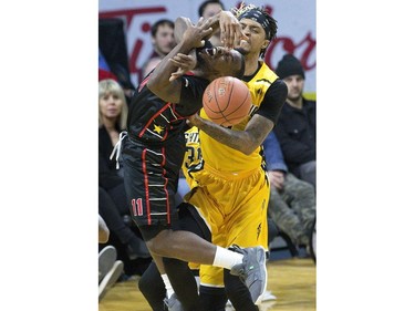 Chris Jones of the Windsor Express is fouled Mo Bolden of the London Lightning in the first half of their NBL game at Budweiser Gardens in London, Ont. on Sunday February 10, 2019. Derek Ruttan/The London Free Press/Postmedia Network