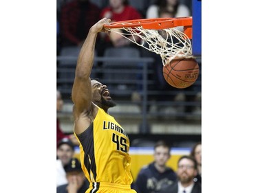 The London Lightning's Marvin Phillips slams home two points  in the first half of their NBL game against the Windsor Express at Budweiser Gardens in London, Ont. on Sunday February 10, 2019. Derek Ruttan/The London Free Press/Postmedia Network