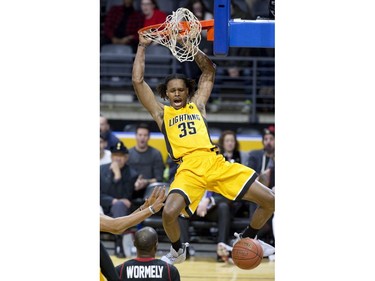 The London Lightning's AJ Gaines slams home two points  in the first half of their NBL game against the Windsor Express at Budweiser Gardens in London, Ont. on Sunday February 10, 2019. Derek Ruttan/The London Free Press/Postmedia Network