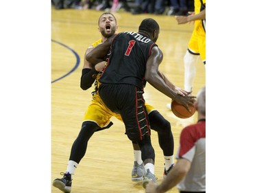 The Windsor Express' Juan Pattillo runs over Garrett Williamson of the London Lightning in the first half of their NBL game at Budweiser Gardens in London, Ont. on Sunday February 10, 2019. Williamson was called for a foul on the play. Derek Ruttan/The London Free Press/Postmedia Network