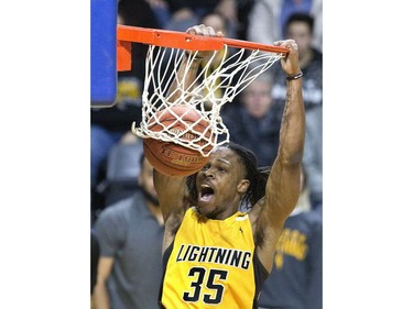 The London Lightning's AJ Gaines slams home two points  in the second half of their NBL game against the Windsor Express at Budweiser Gardens in London, Ont. on Sunday February 10, 2019. Derek Ruttan/The London Free Press/Postmedia Network