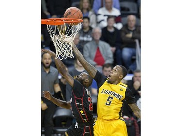 The London Lightning's  Kevin Ware lays up two points while covered by Horace Wormely of the Windsor Express in the second half of their NBL game at Budweiser Gardens in London, Ont. on Sunday February 10, 2019. Derek Ruttan/The London Free Press/Postmedia Network