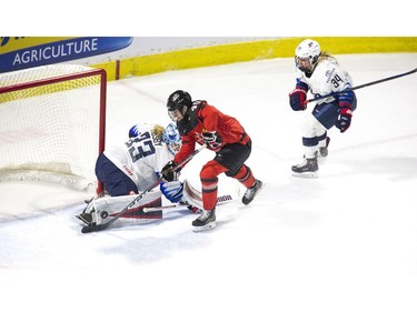 Team USA goalie Alex Rigby stops Team Canada's Blayre Turnbull in the first period of their game at Budweiser Gardens in London, Ont. on Tuesday February 12, 2019.  (Derek Ruttan/The London Free Press)
