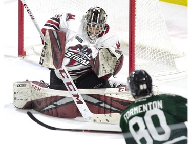 London Knights' Alex Formenton puts a wrinkle in the sweater of Guelph Storm goalie Anthony Popvich during the first period of their OHL game at Budweiser Gardens in London on Wednesday Feb. 13, 2019. Derek Ruttan/The London Free Press