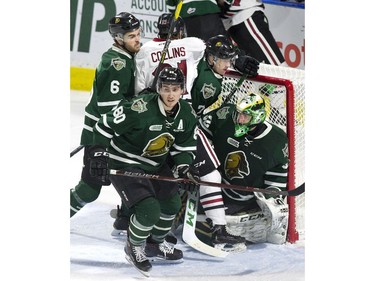 The crease of  London Knights goalie Joseph Raaymakers  gets crowded with teammates Riley Coome (6) Alex Formenton (80), Joey Keane (7) and Ty Collins of the Guelph Storm during the second period of their OHL game at Budweiser Gardens in London on Wednesday Feb. 13, 2019. Derek Ruttan/The London Free Press