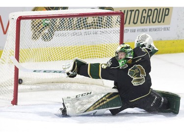 London Knights goalie Joseph Raaymakers can only stretch so far as Joseph Mack scores a short-handed goal for the Erie Otters in first period of their game in London on Friday (Derek Ruttan/The London Free Press)
