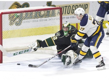 Erie Otter Maxim Golod puts his team ahead 3-1 by sliding the puck  past London Knights goalie Joseph Raaymakers in the first period of their game in London on Friday. (Derek Ruttan/The London Free Press)