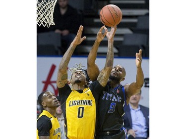 Tramar Sutherland  of the Kitchener Waterloo Titans and Mo Bolden of the London Lightning  battle for a rebound during their game in London on Sunday Feb. 17, 2019. Derek Ruttan/The London Free Press