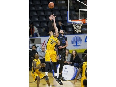 Garrett Williamson of the London Lightning and Derek Hall of the Kitchener Waterloo Titans reach for a high pass during their game in London on Sunday Feb. 17, 2019. Derek Ruttan/The London Free Press
