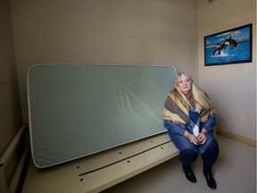 Martha Connoy, director of the community mental health program at Mission Services in London, sits Tuesday in one of the rooms where the agency will have to close beds by April 1 due to a funding crunch. (Mike Hensen/The London Free Press)