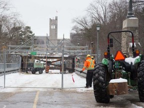 Workers continue with repairs on the University Drive bridge at Western University Wednesday. The bridge is expected to reopen next month, with a load limit, after weather slowed repairs begun in October. (DEREK RUTTAN, The London Free Press)